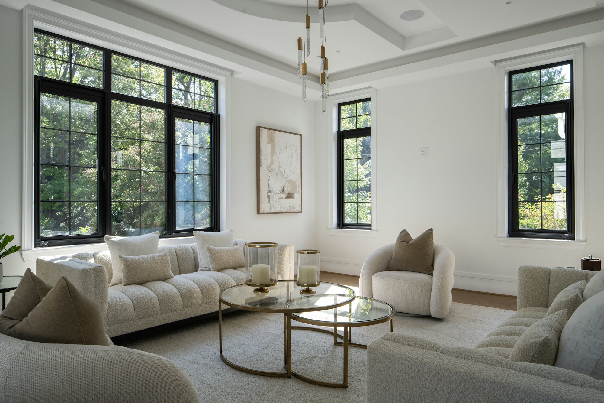 Elegant living room with light furniture and large windows